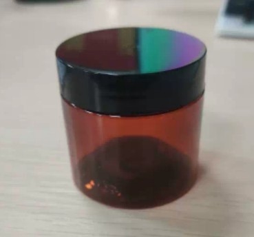 Zamknięcie 100 ml plastikowego słoika kosmetycznego z czułą na ciśnienie uszczelnieniem i niestandardowym drukiem