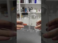 Plastikowe butelki z sokiem z pokrywkami